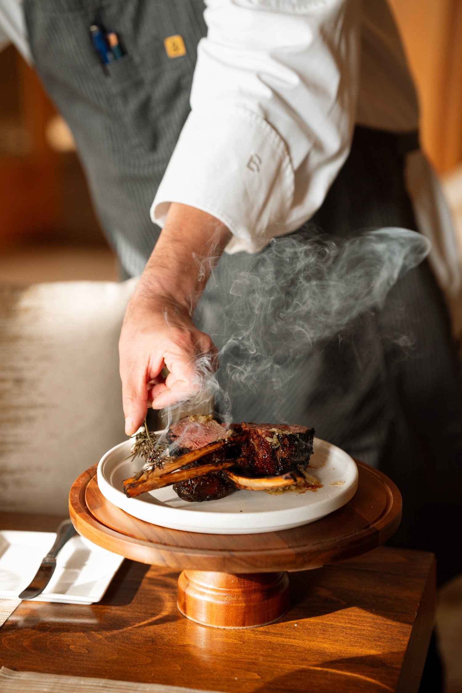 Chef plating smoked short rib