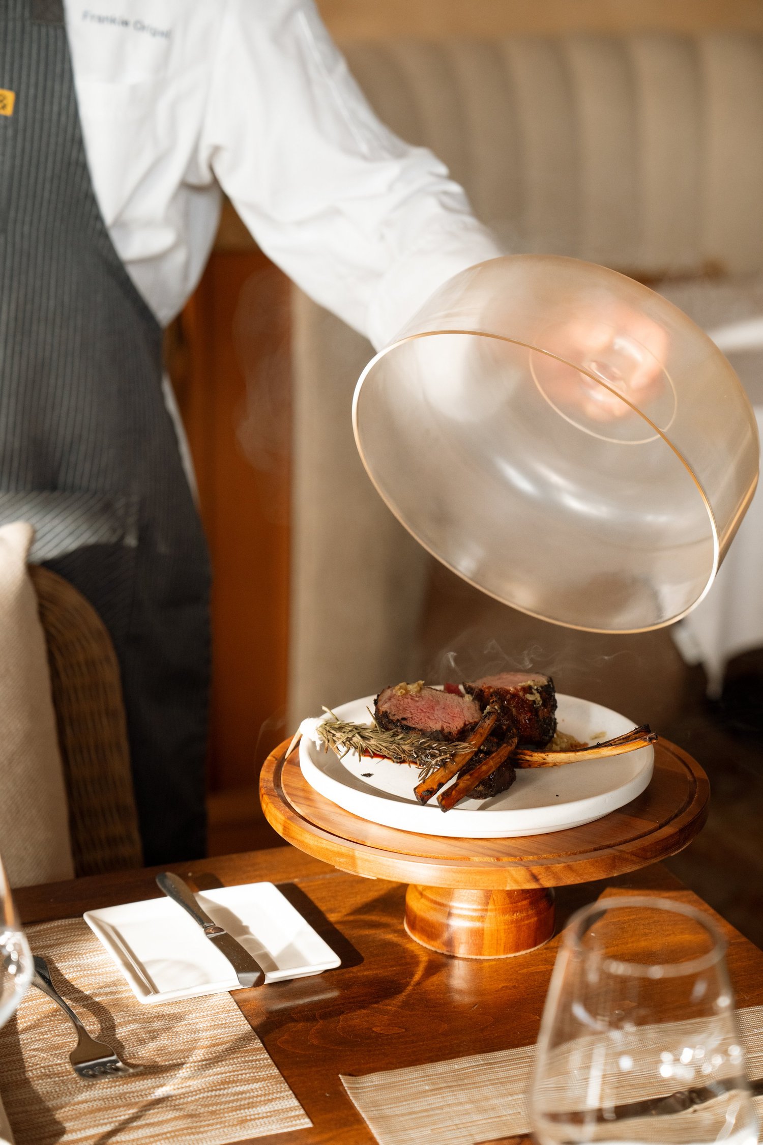 Cloche lifted at the table